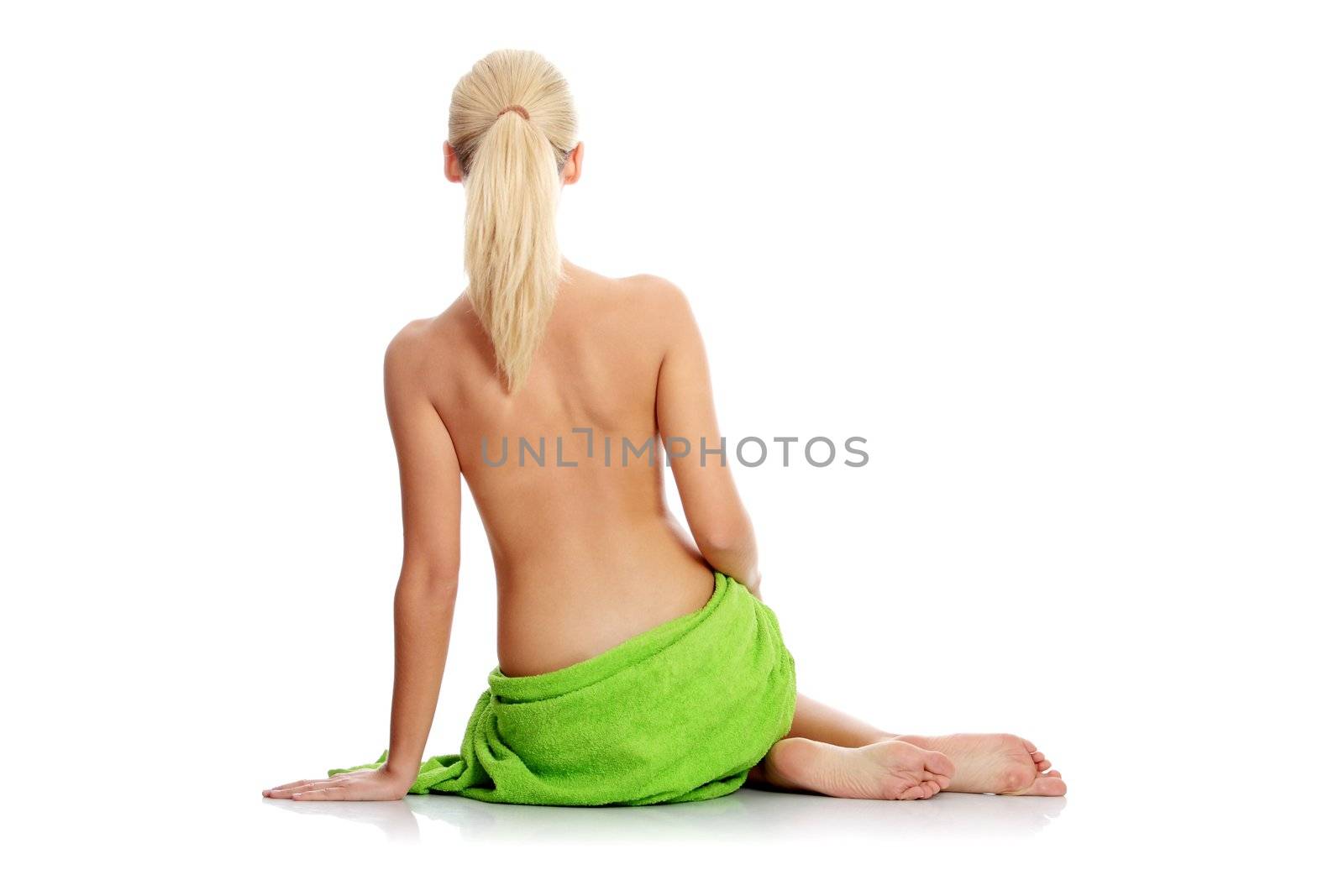 Young beautiful nude blond woman with towel , isolated on white