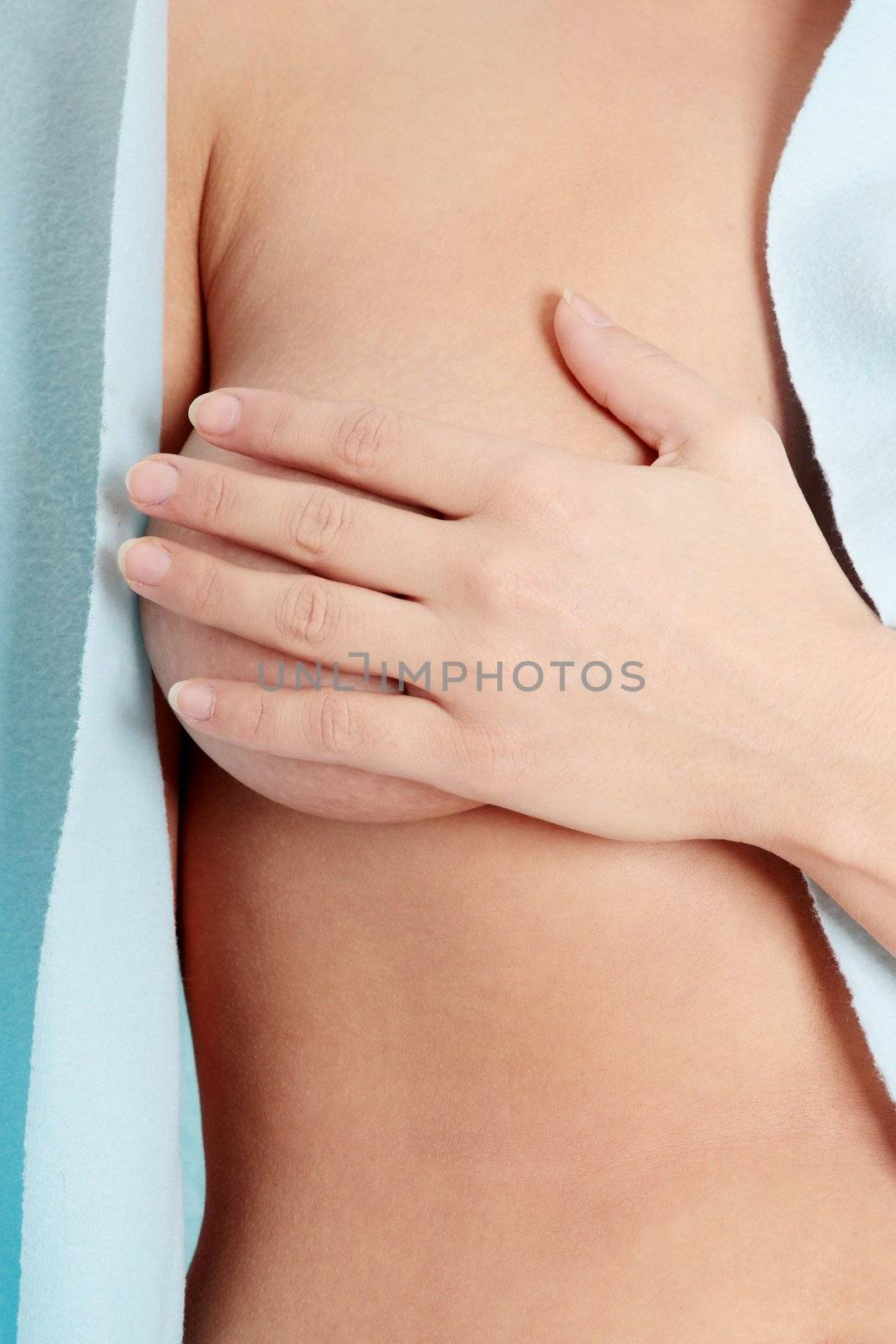 Breast care concept - woman in bathrobe , isolated