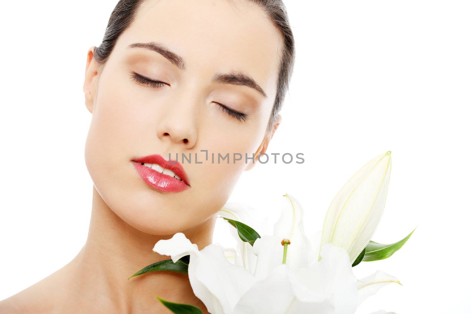 Spa woman with lily flower in white background