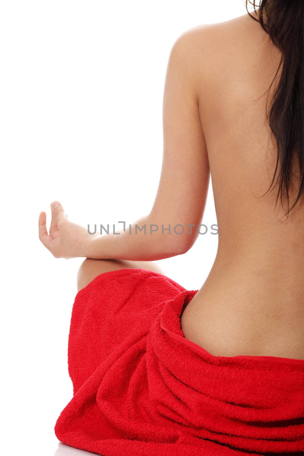 Young beautiful nude woman meditating by BDS