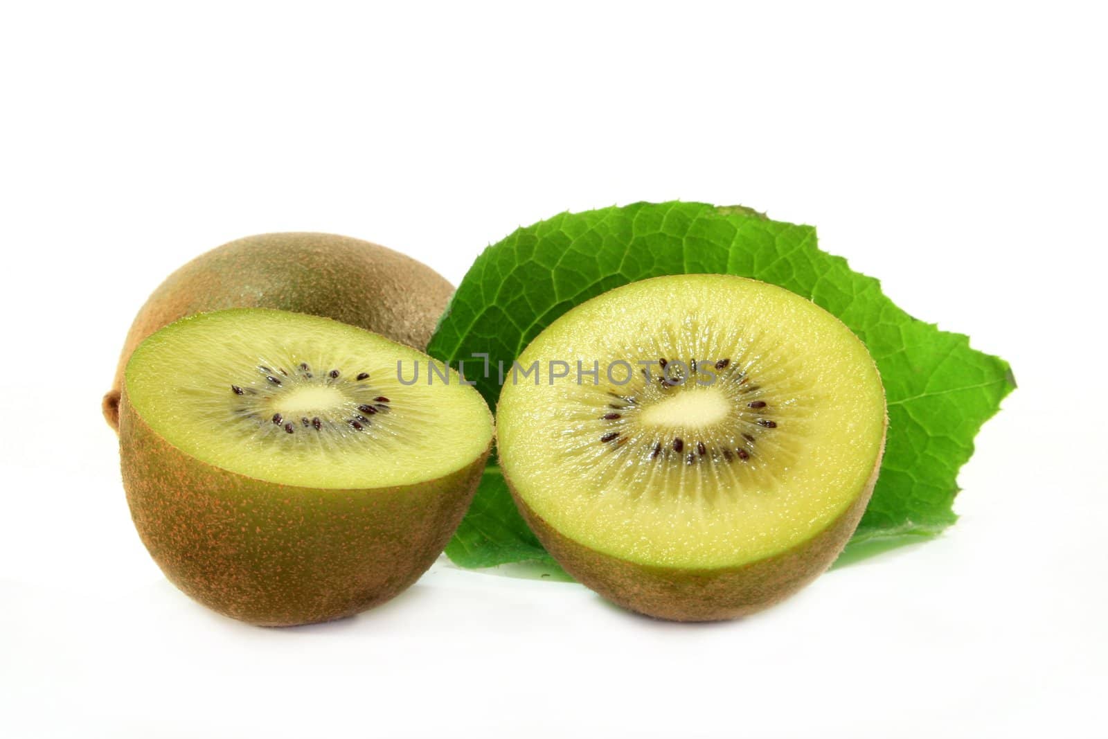 halved kiwi fruit on white background