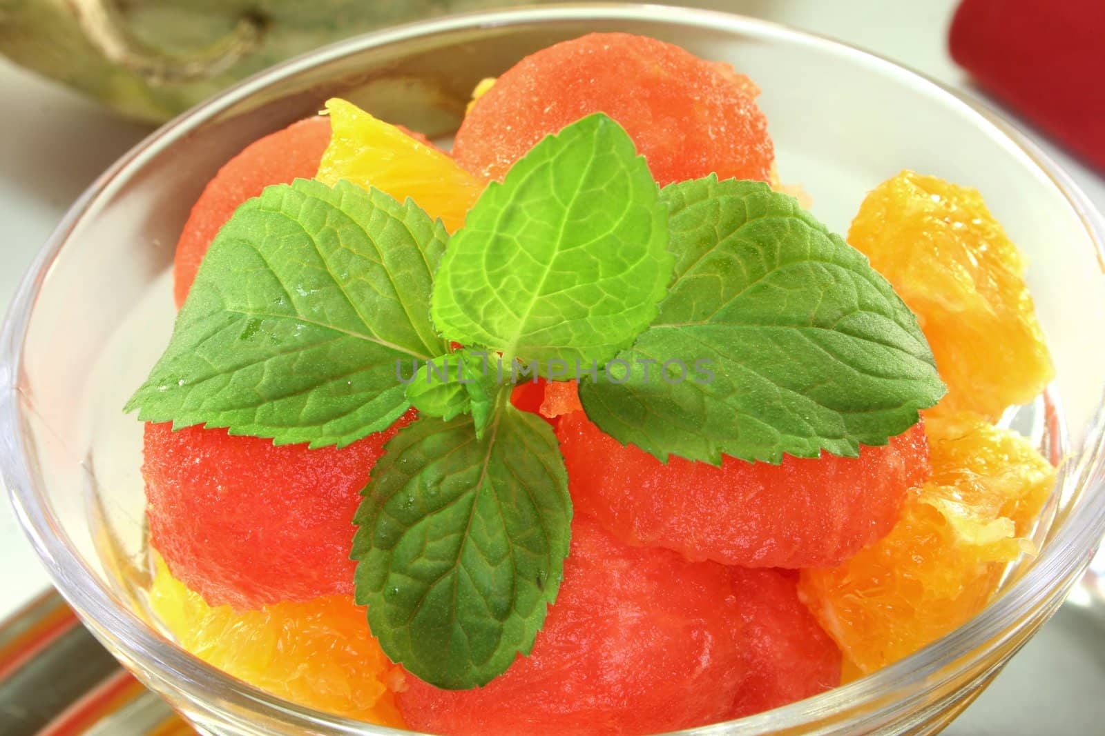 a Melon orange salad with fresh pepper mint