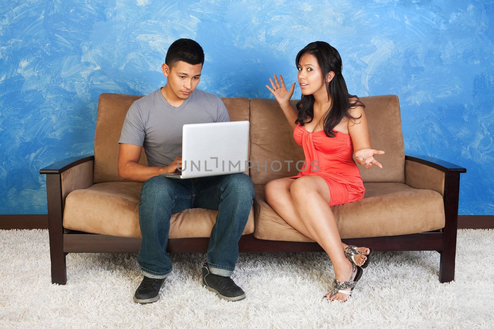 Young Hispanic girl with man on computer