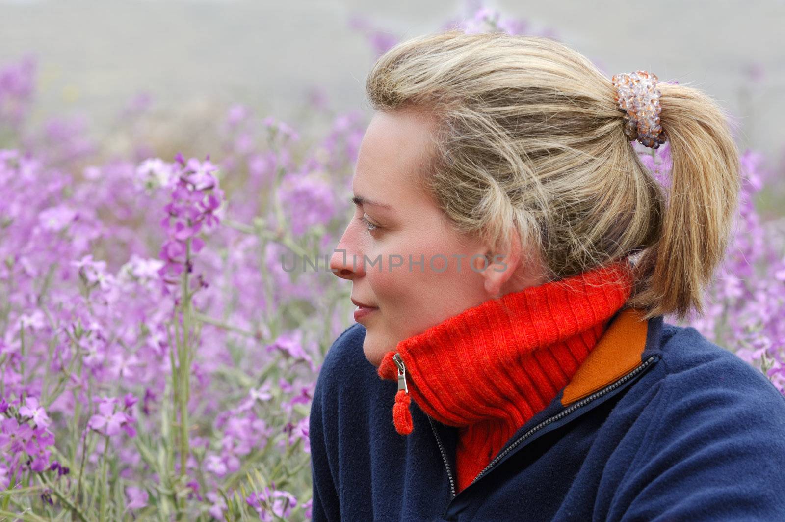 Beautiful young woman in casual clothes, enjoying the countryside during an early spring morning