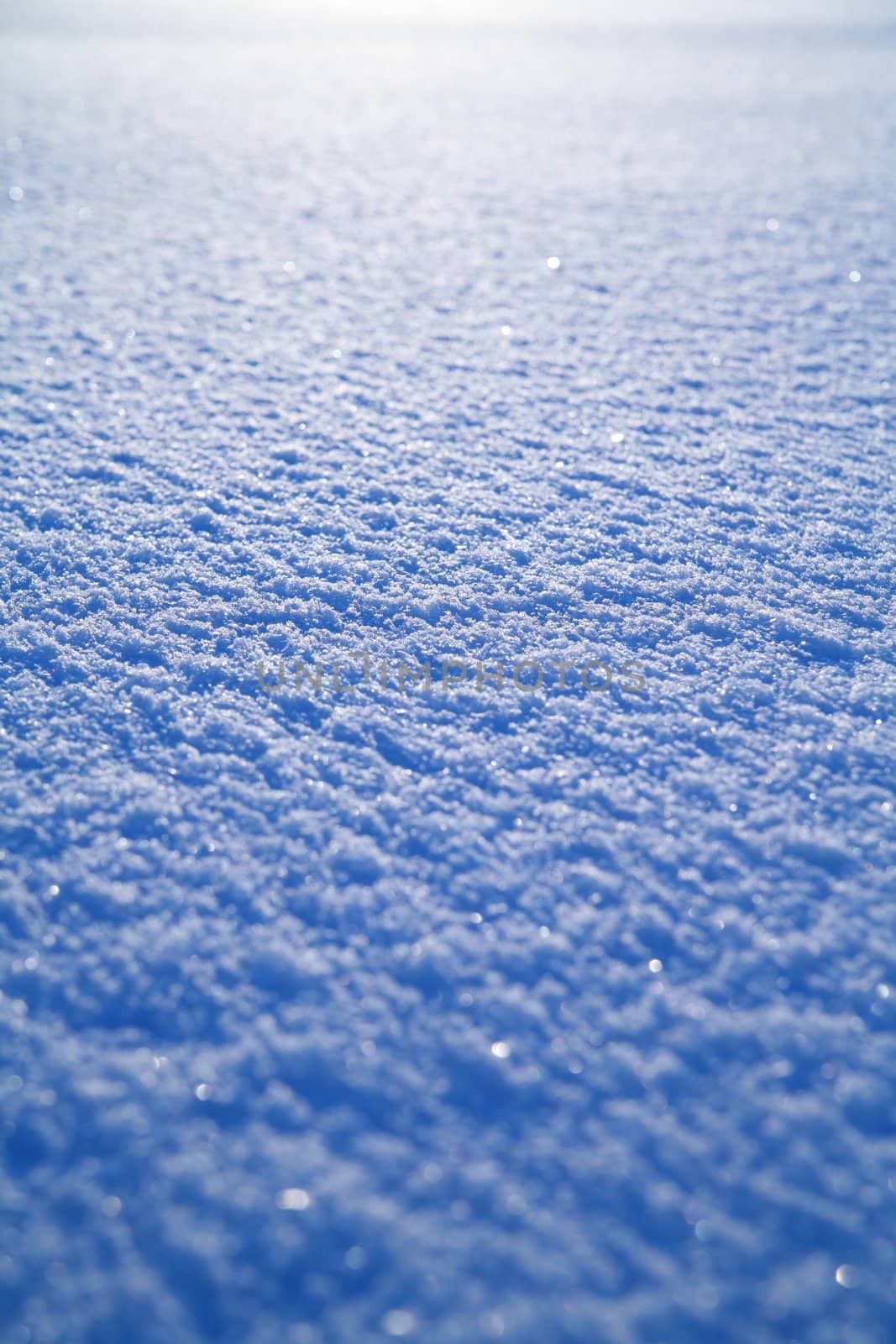 Details of a beautiful snow surface perfect for backgrounds on greeting cards etc.