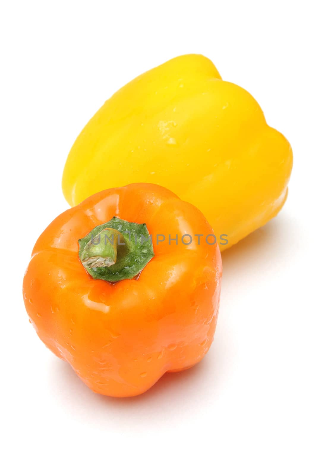 Yellow and orange peppers isolated on white background