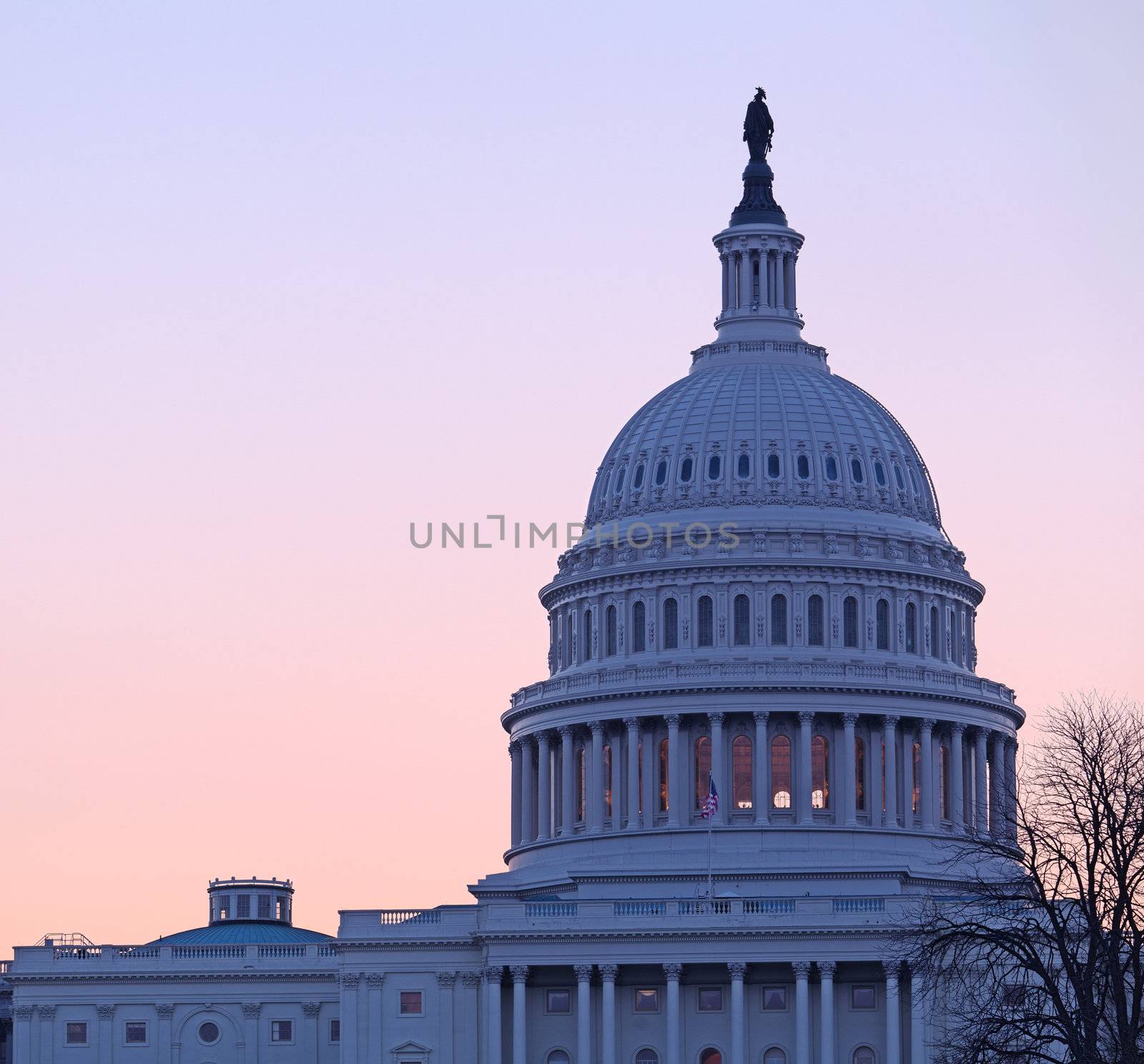 Sunrise behind the dome of the Capitol in DC by steheap