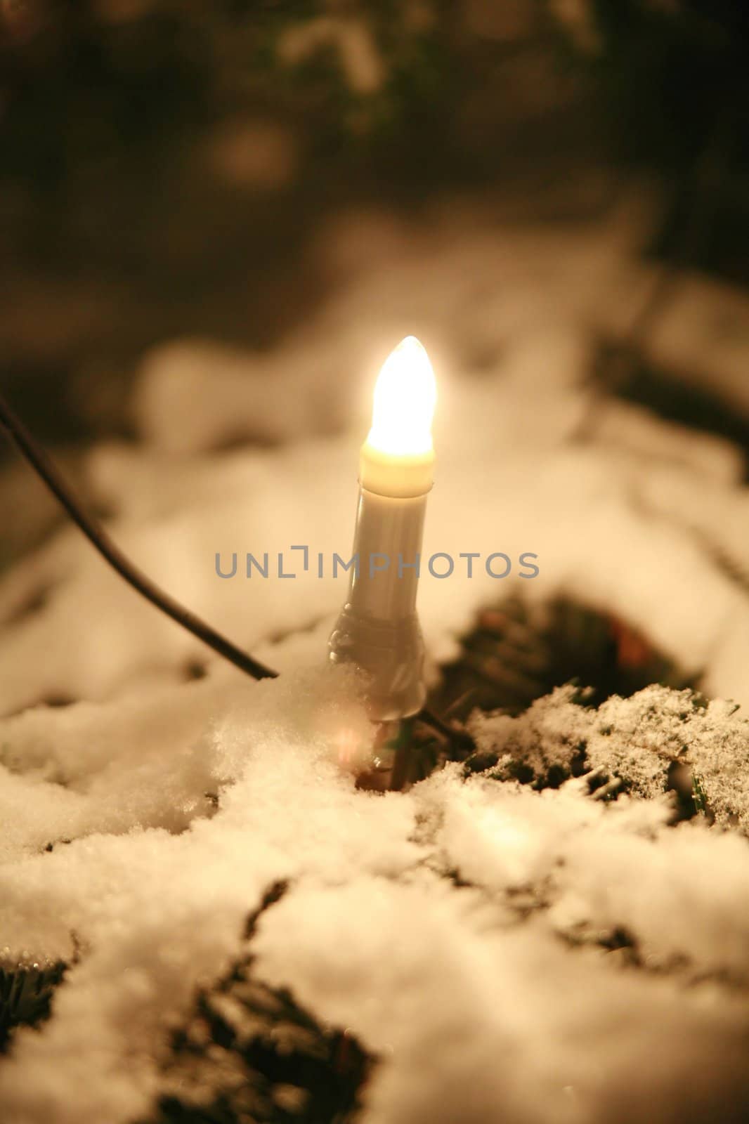 xmastree at night with snow and electric candles, very shallow DOF!............