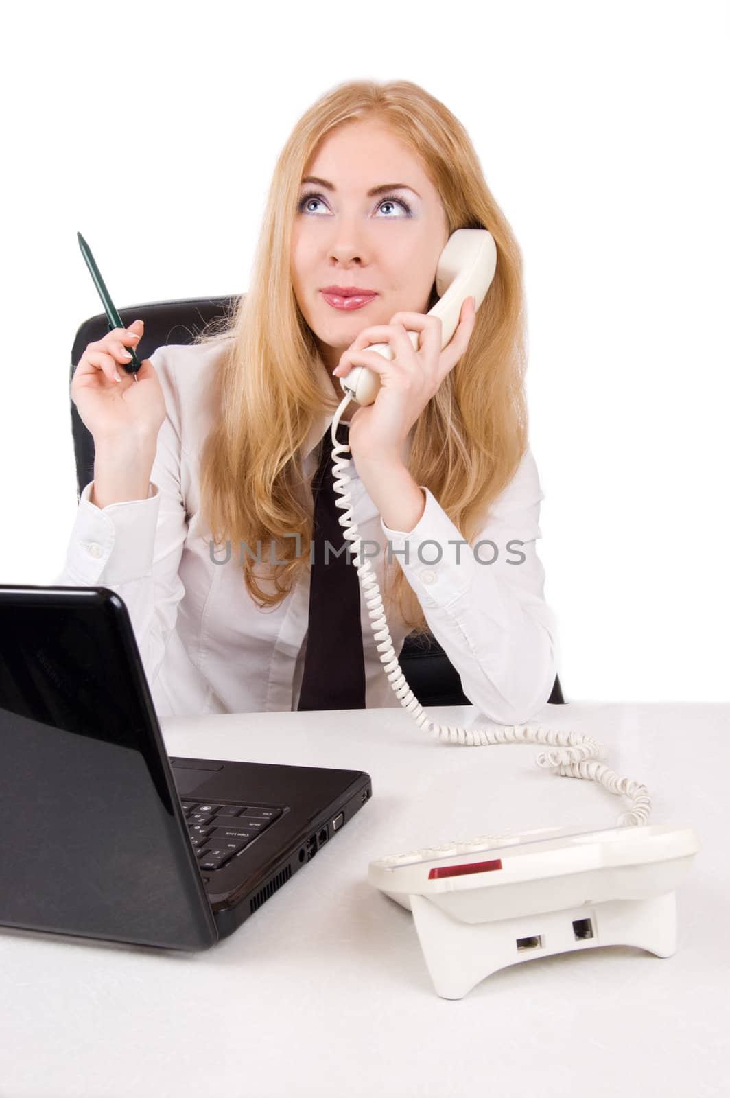 Businesswoman talking on telephone with laptop over white