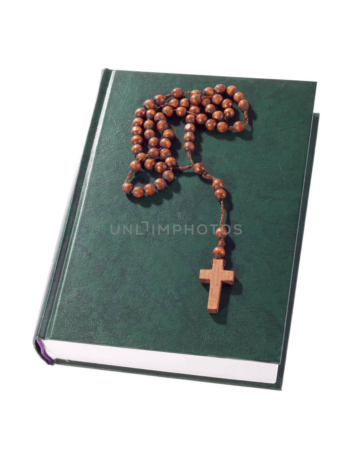 wooden rosary on the Bible by aguirre_mar