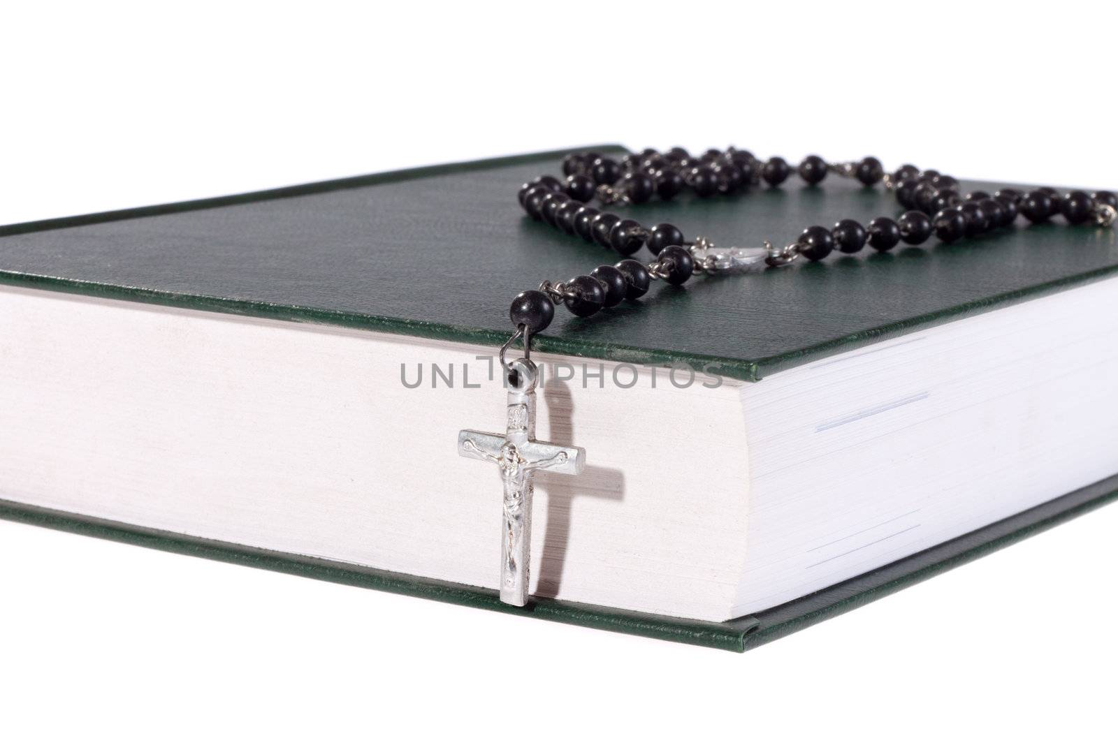 rosary on the Bible, isolated on white