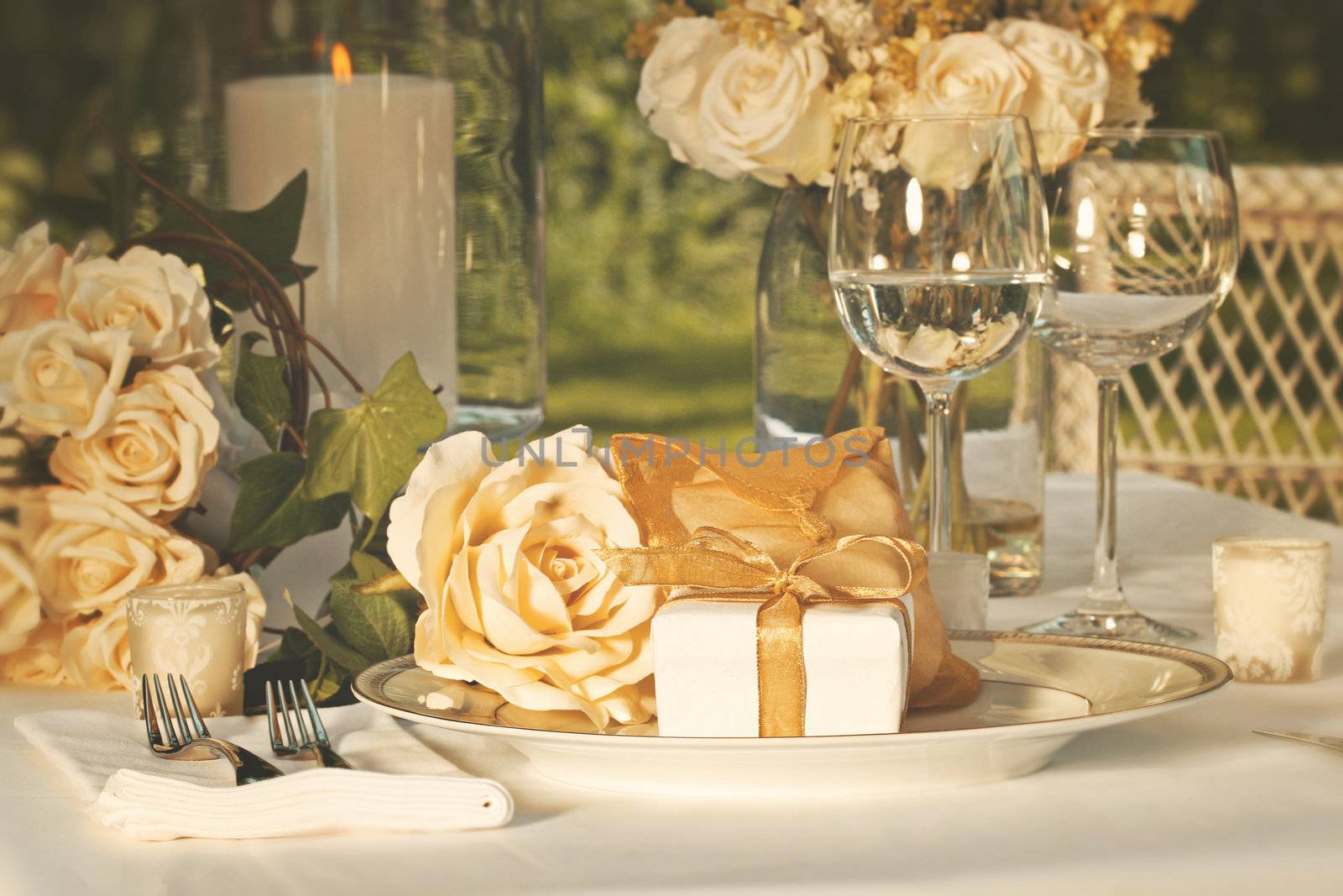 Gold wedding party favors on plate at reception