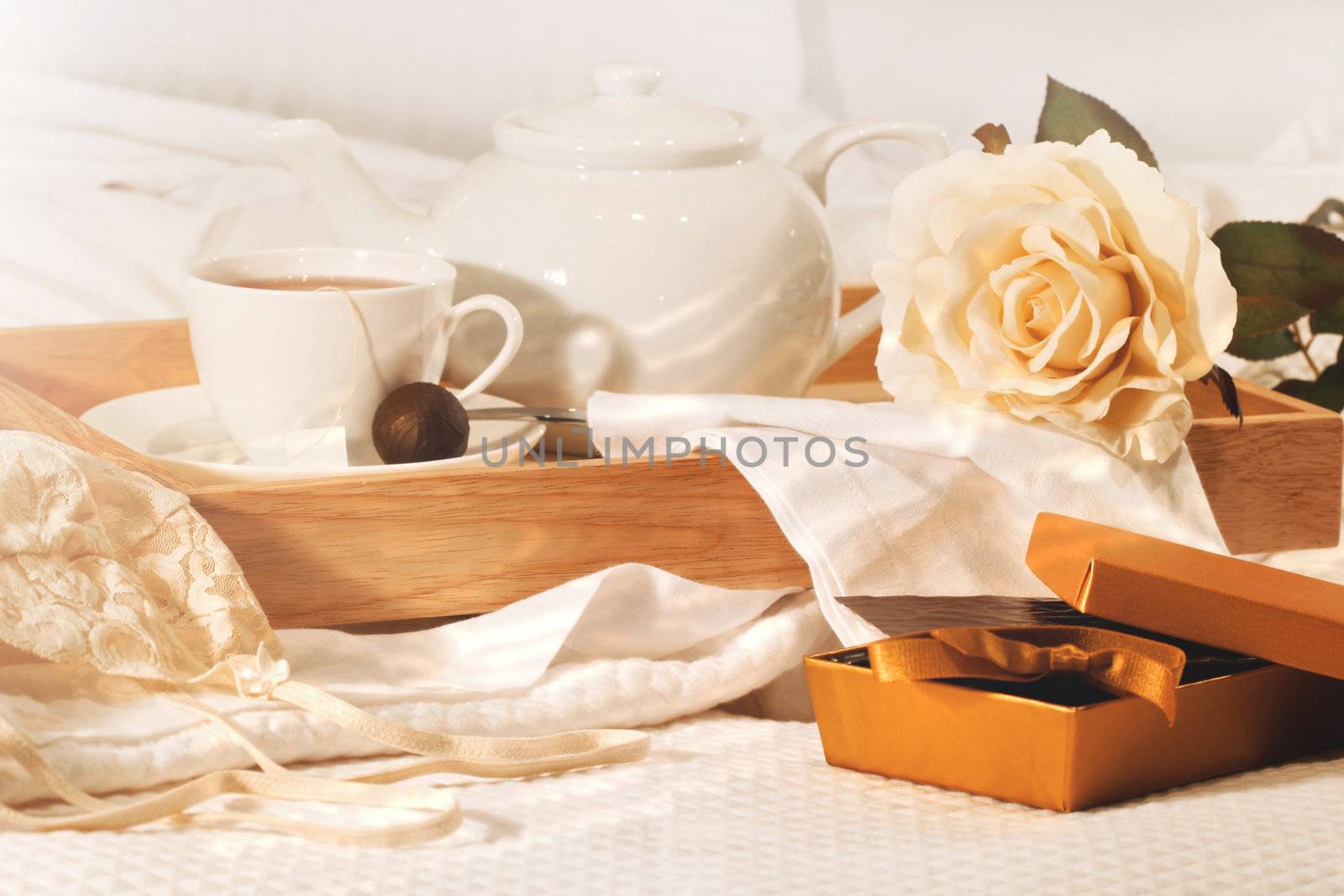 Relaxing in bed with tea and chocolates by Sandralise