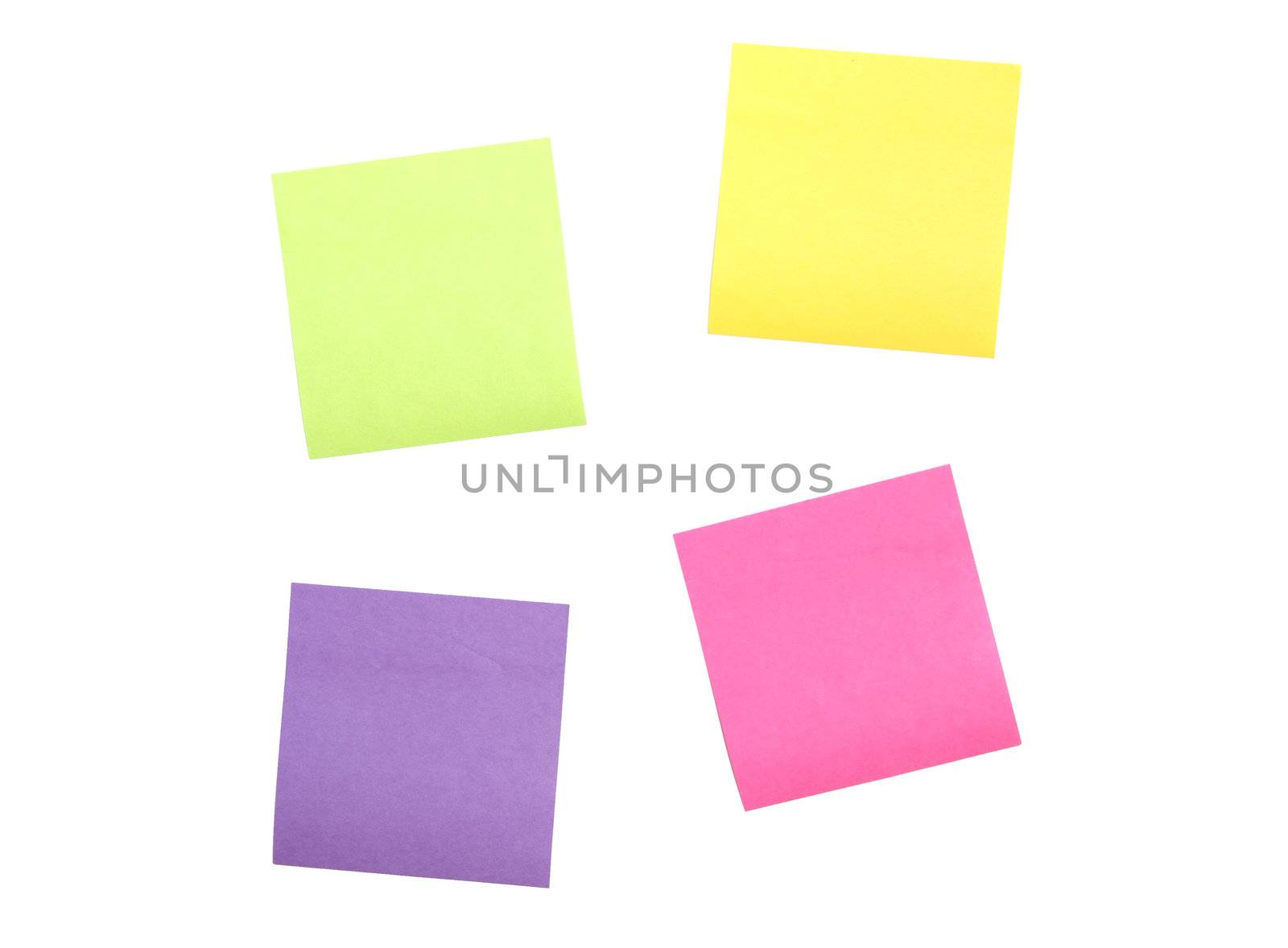 Four multi colored post it notes scattered far apart