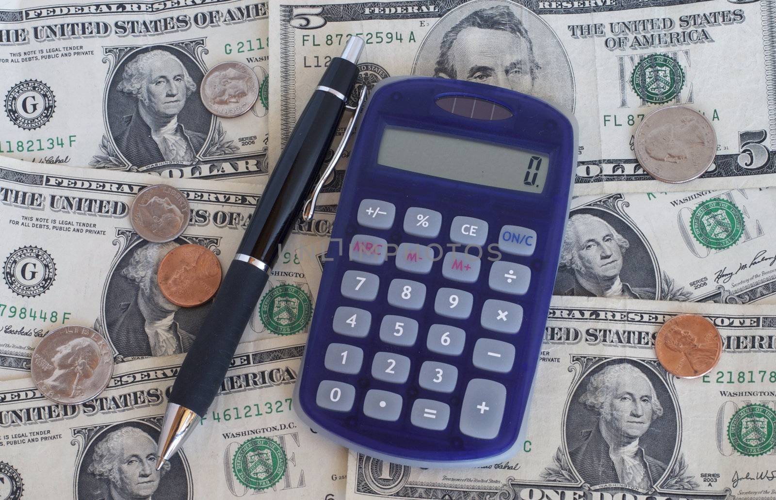 Tax Form with calculator, pen and money
