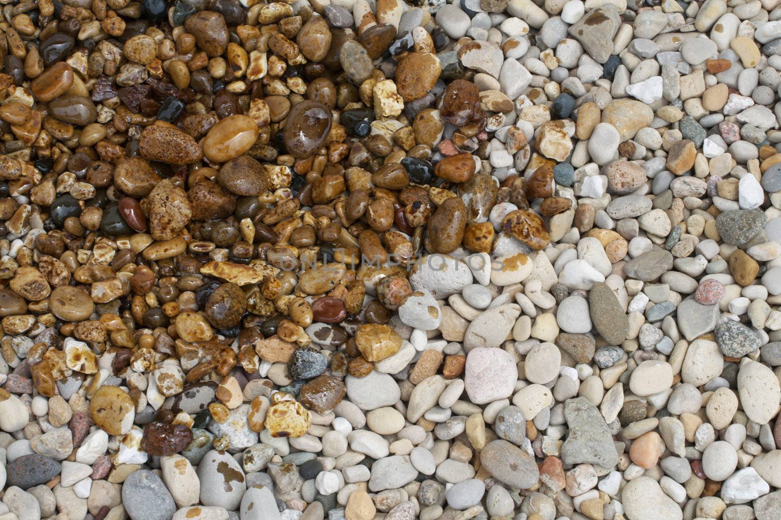 An oil spill pollutes some pristine rocks