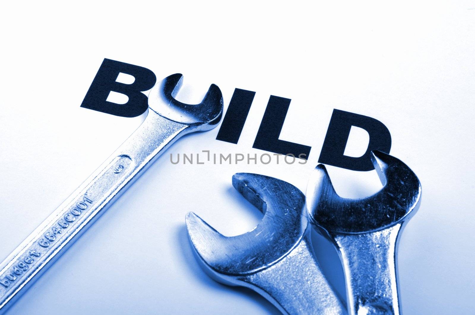 build and tools showing construction concept with word