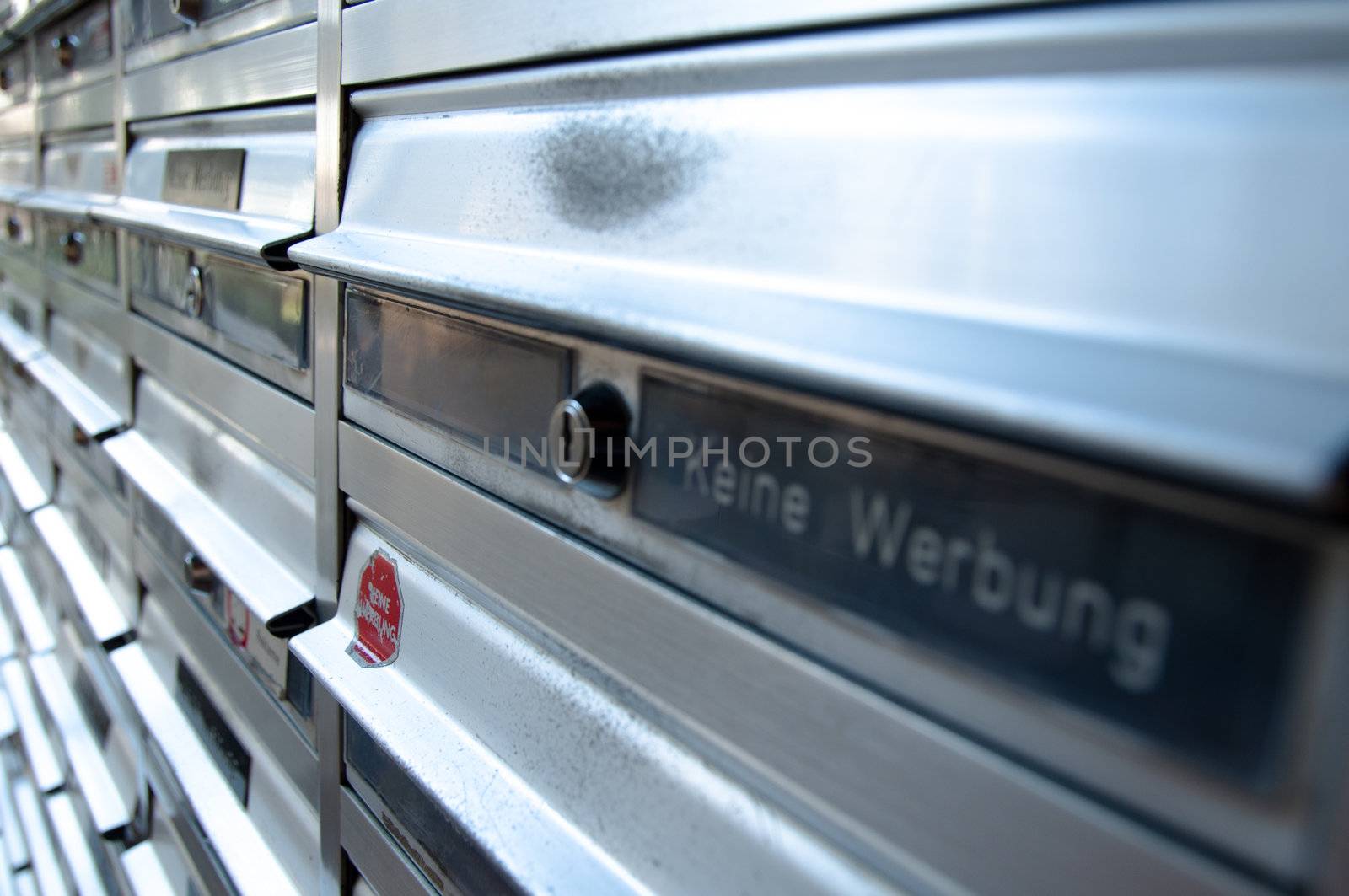 Rows of letterboxes with German "Keine Werbung" (no junkmail) labels