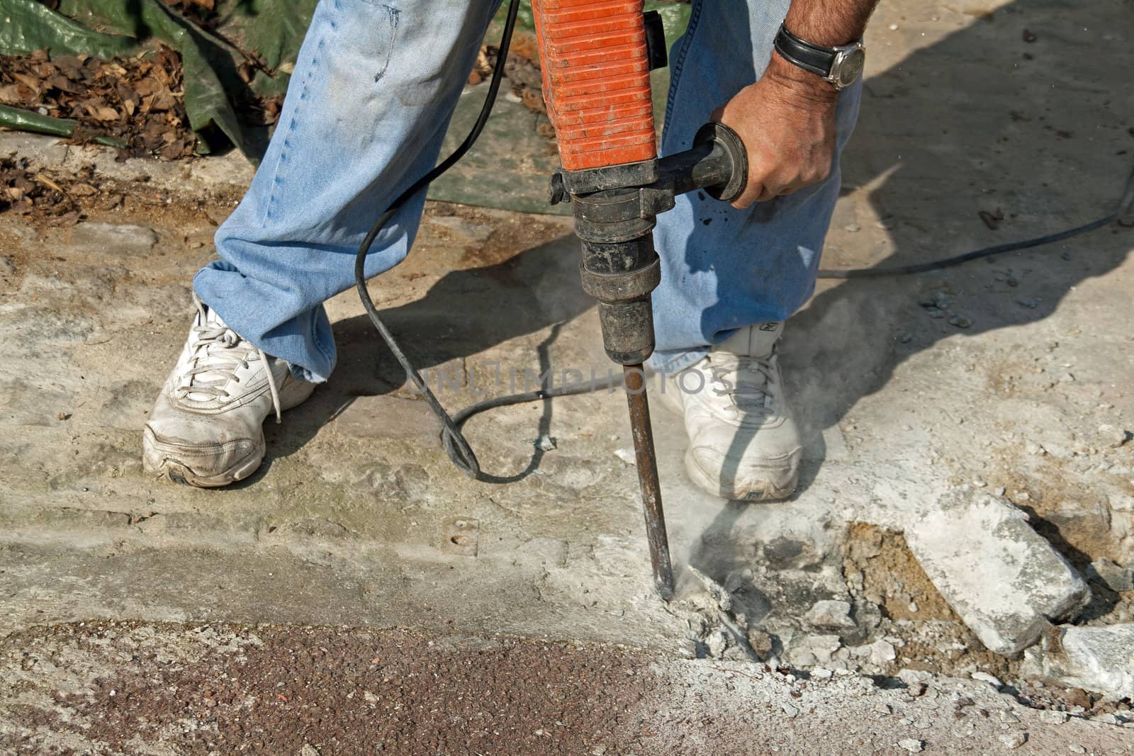 jackhammer running on a road