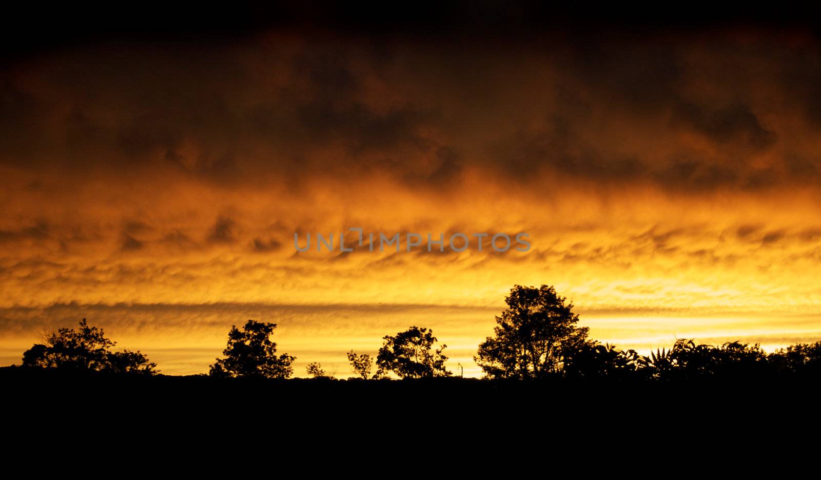 The sky glows fire red after a thunderstorm