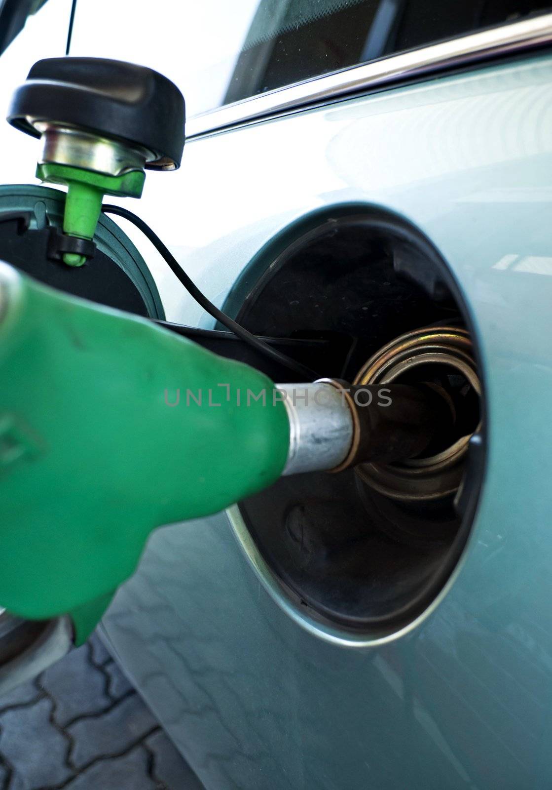 Car supply of unleaded fuel in a petrol station