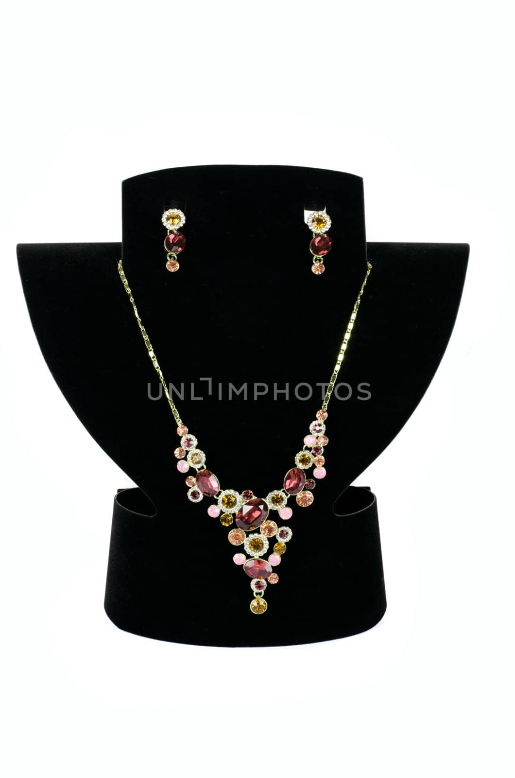 a necklace with pendants and earrings on a white background