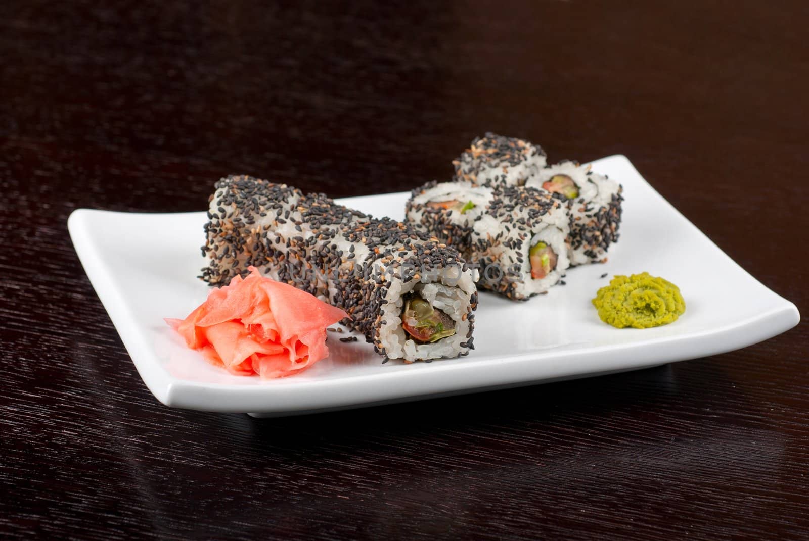 Closeup of Sushi rolls at plate with sesame