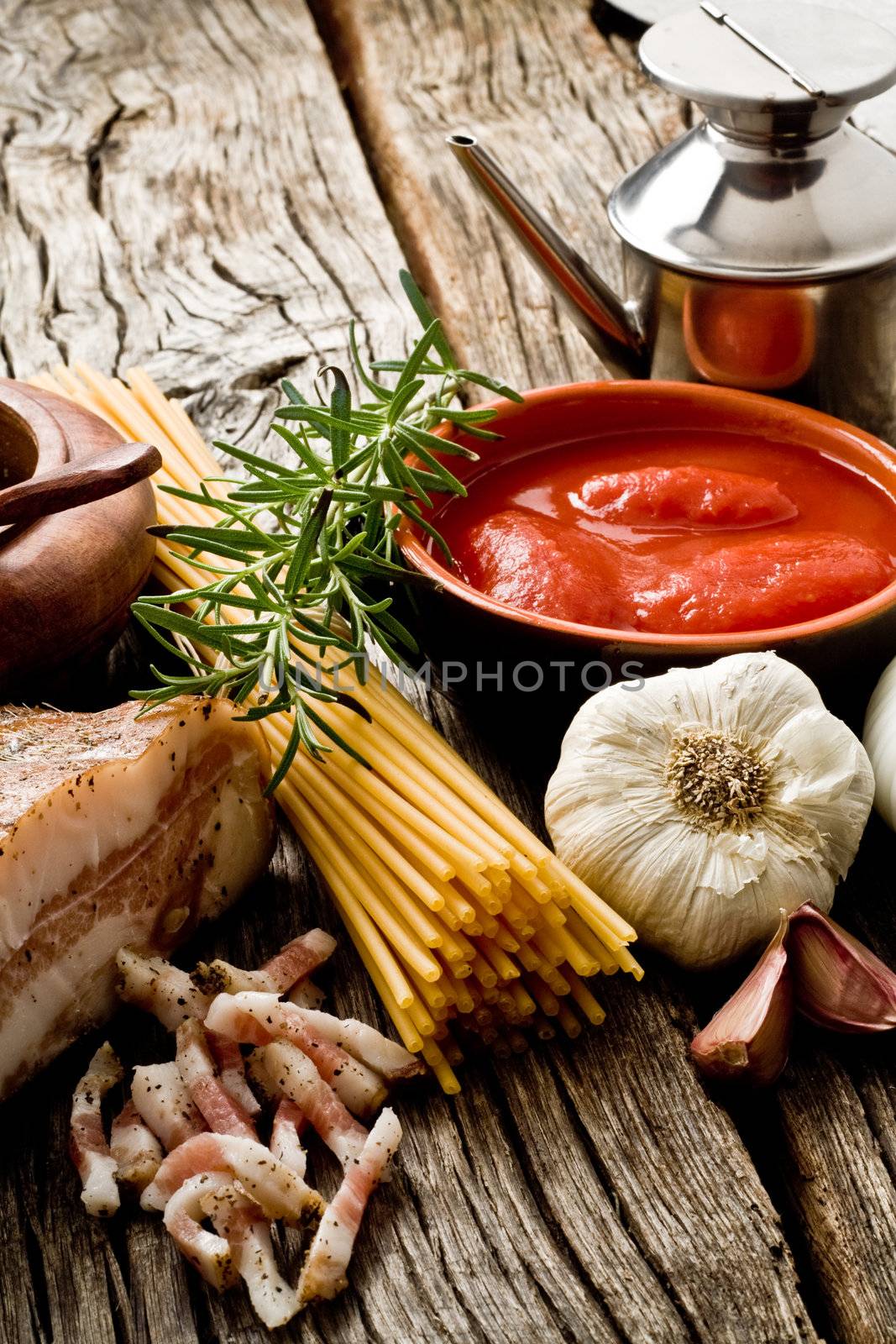 italian traditional pasta amatriciana ingredients on wood