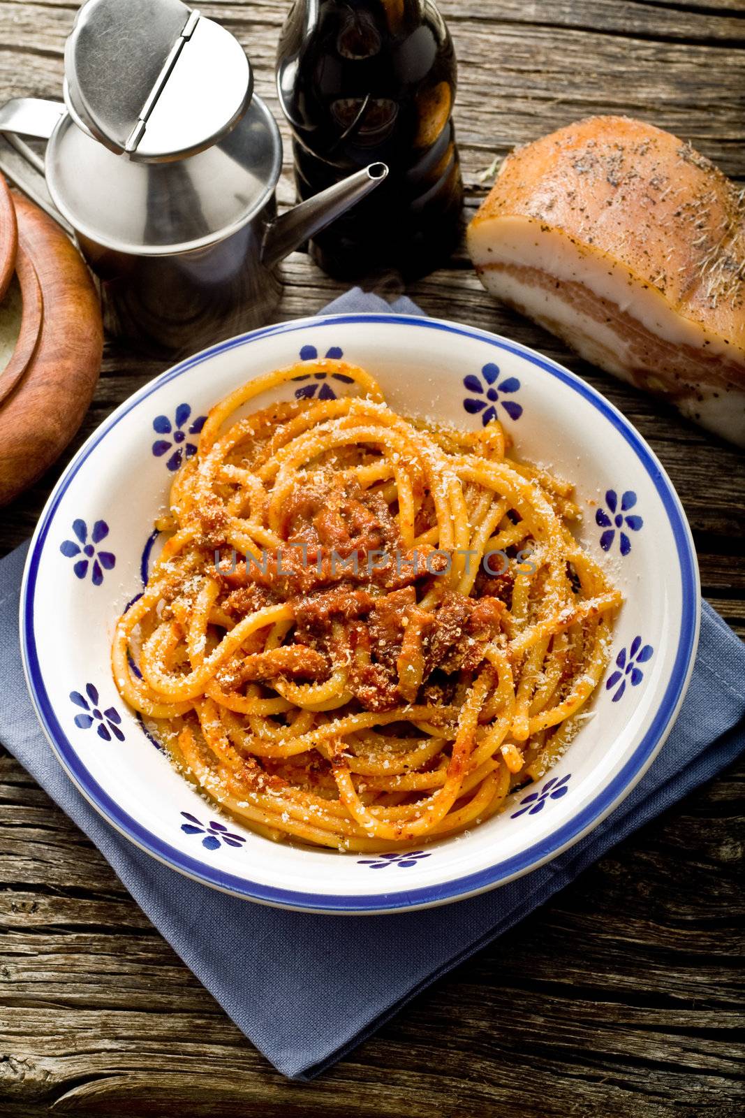 italian traditional pasta amatriciana served ona table wood