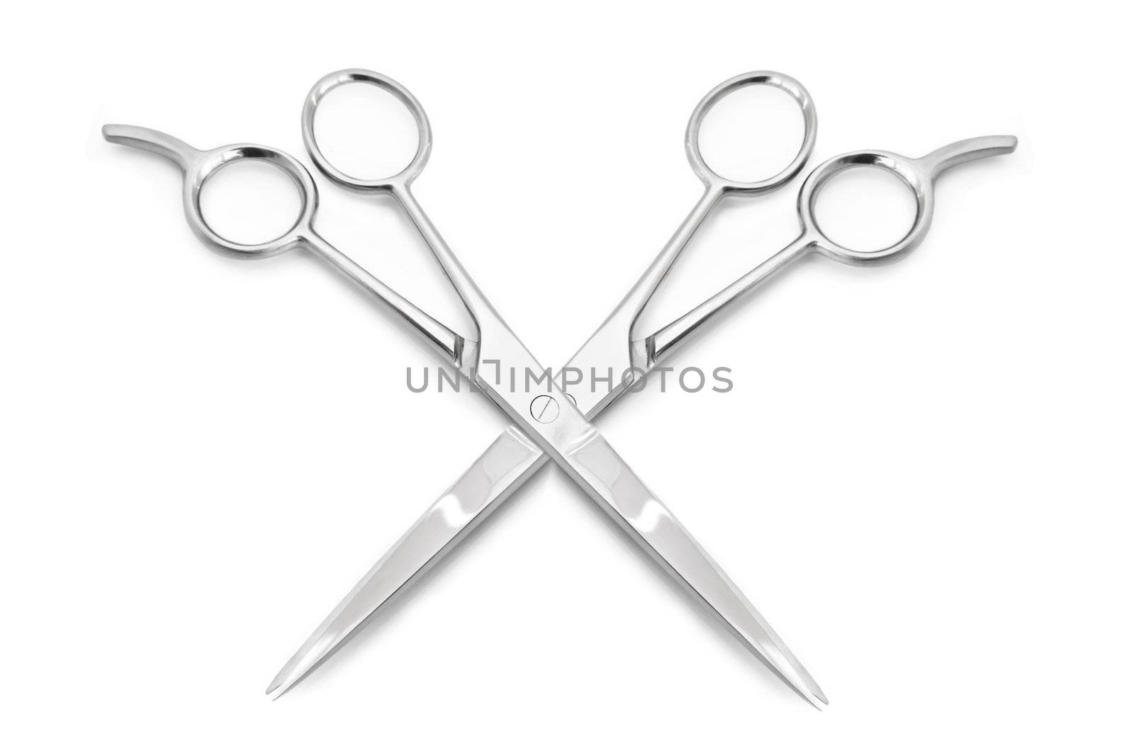 Two stainless steel hairdressing scissors overlapping each other against a white background