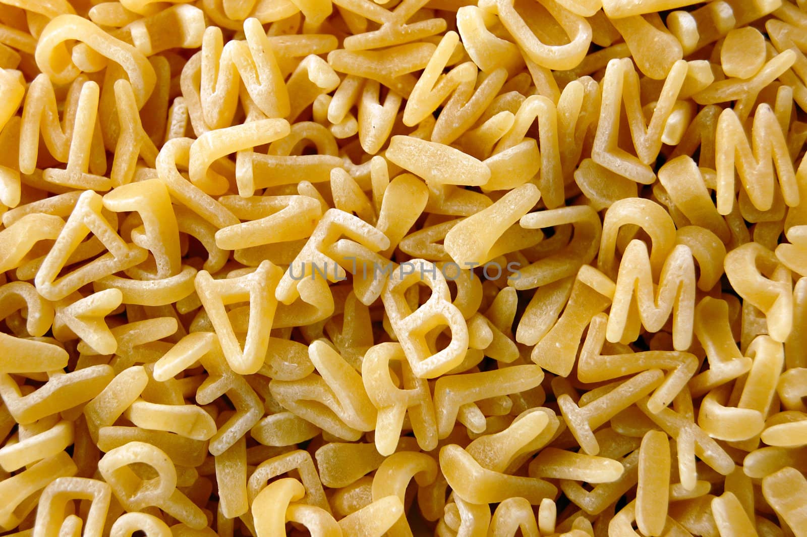 Kids soup letters pasta. Italian food background.