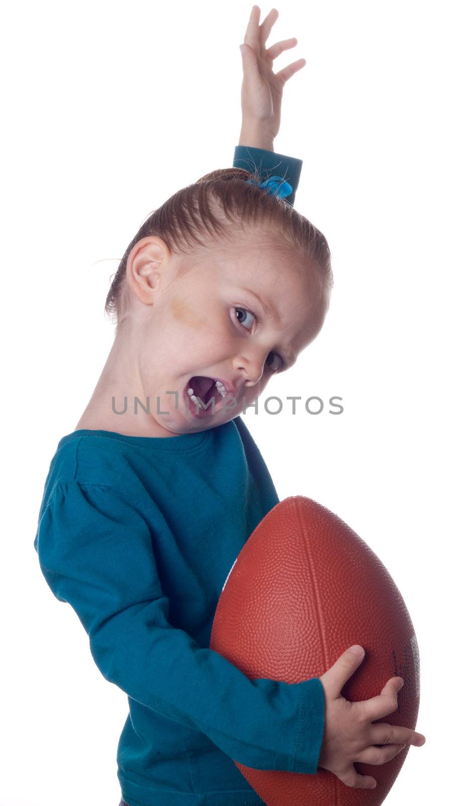 A young child has just scored a touchdown.