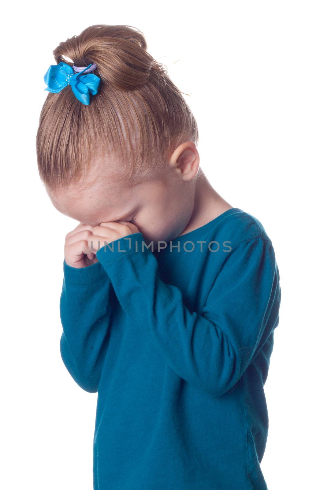A girl is pouting into her hands.  She could be depressed or tired.