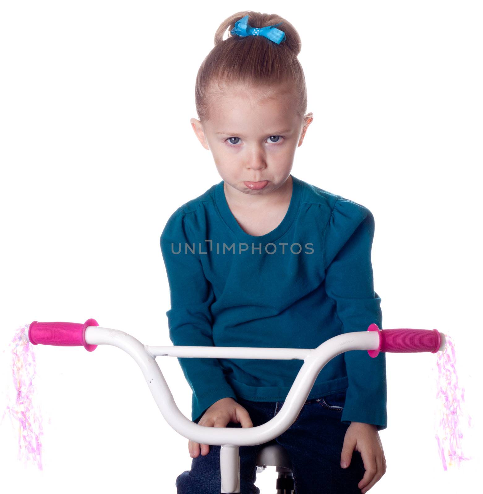 A girl is sad because she has to stop riding her bike.