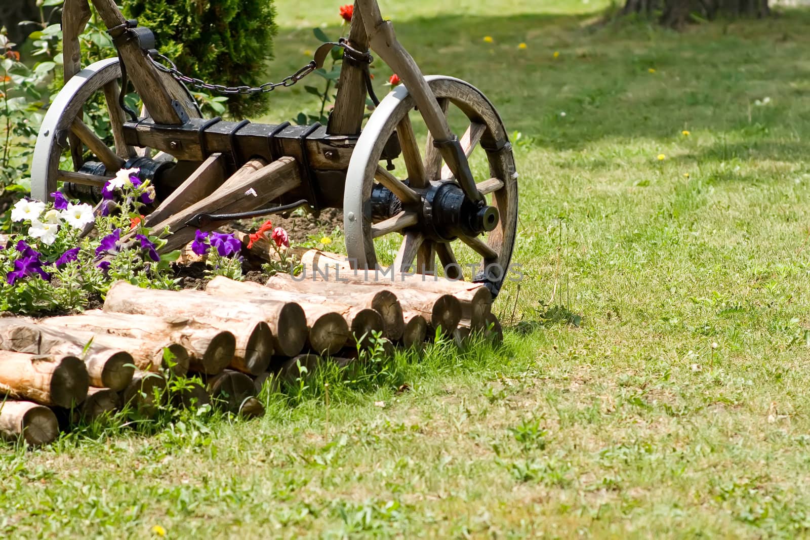 Broken cart on a green lawn