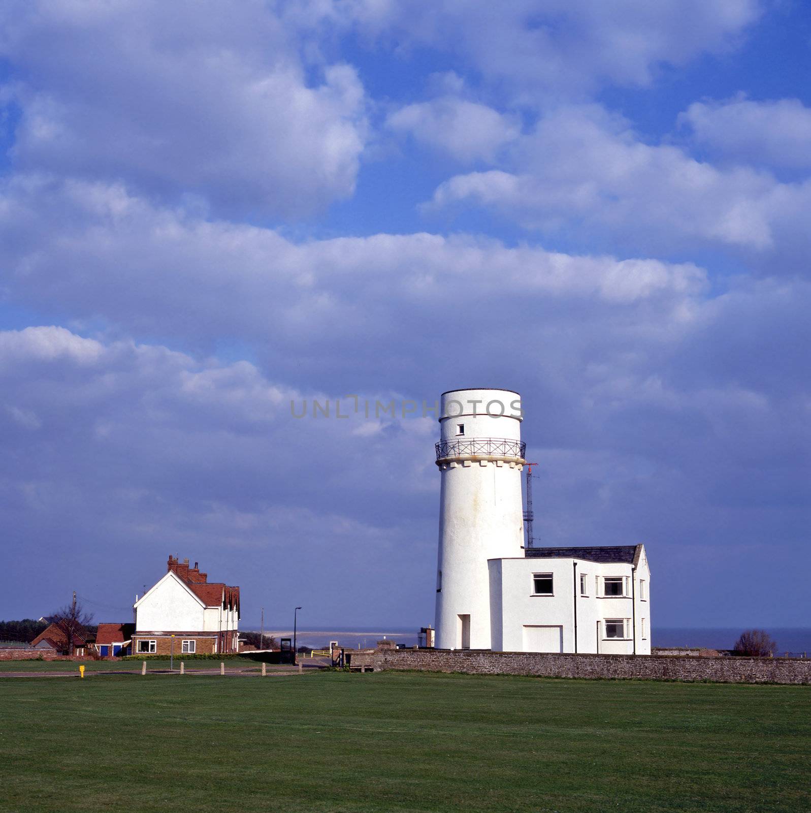 Hunstanton lighthouse standing on a cliff 