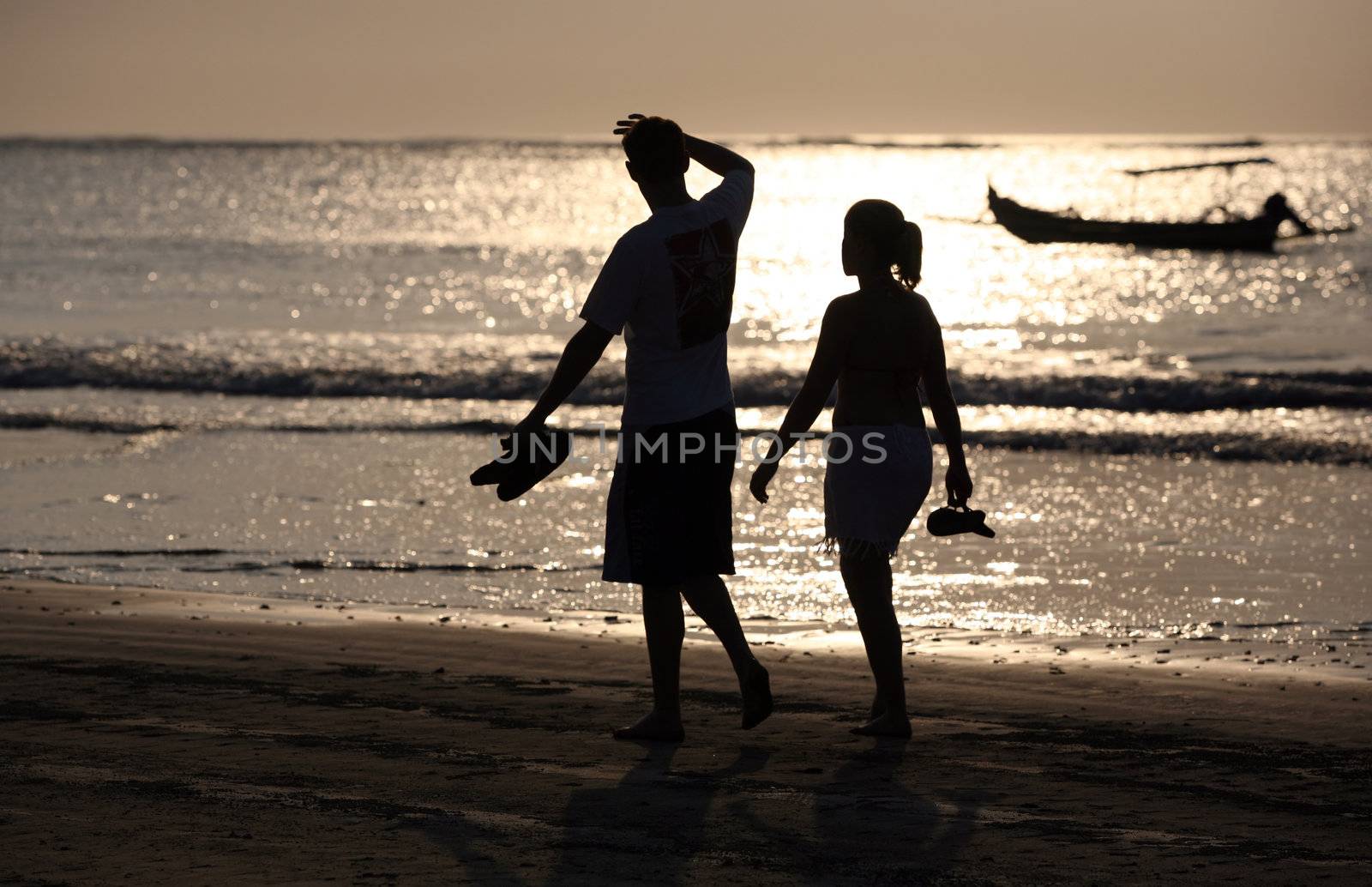 Couple on sunset. Coast of the Indian ocean