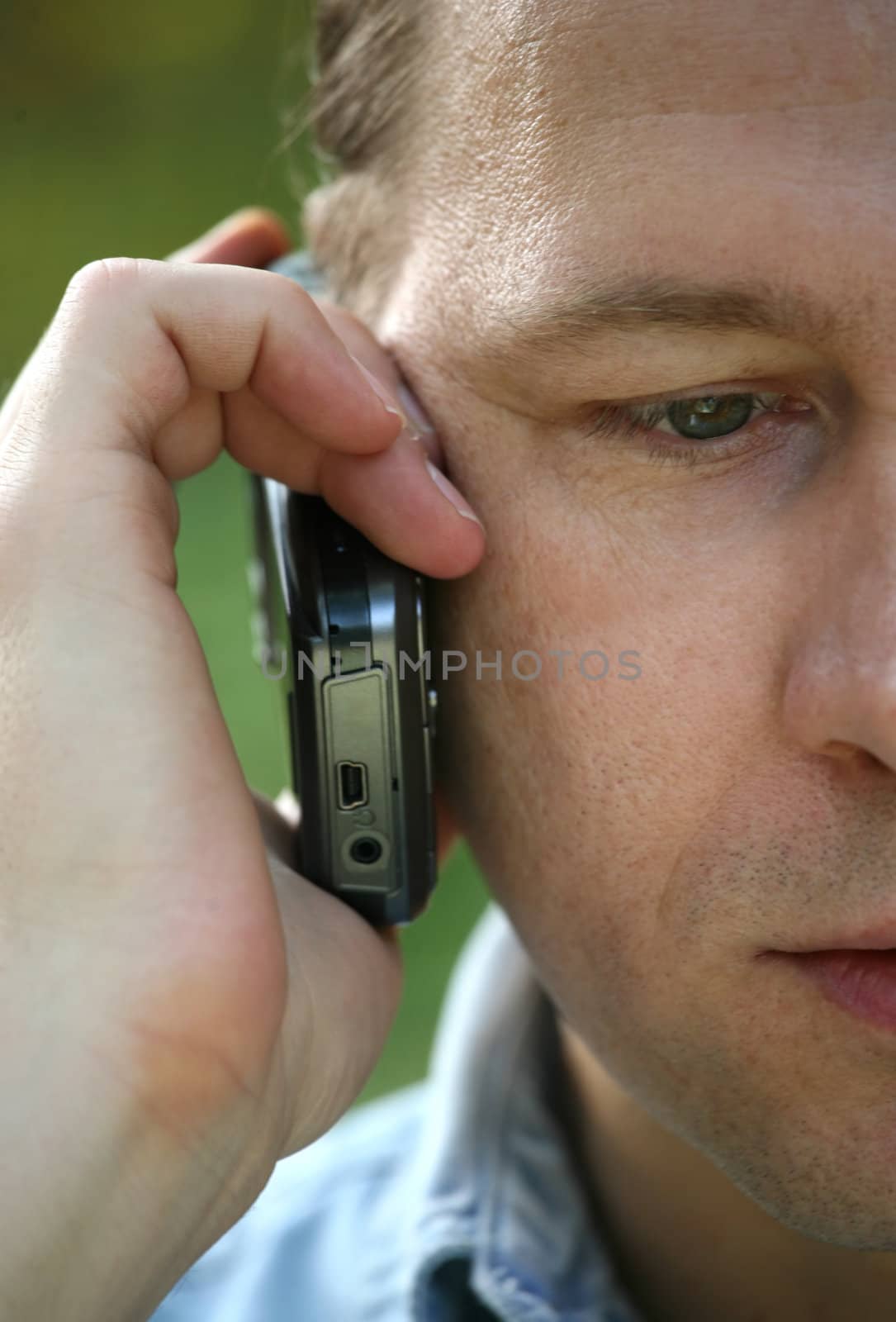 Portrait of the man with the phone close-up