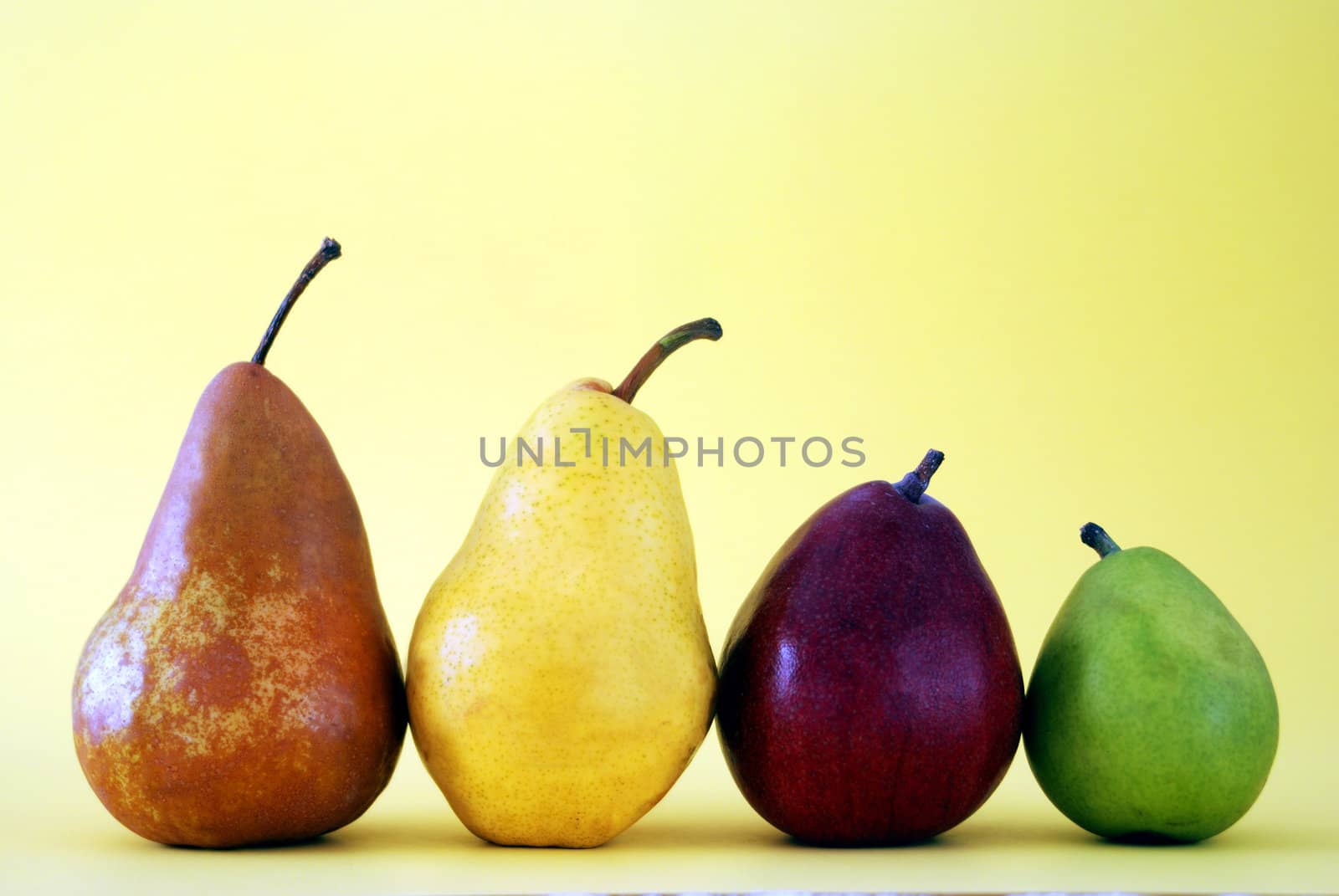 Variety of Pears on Yellow Background by Eponaleah