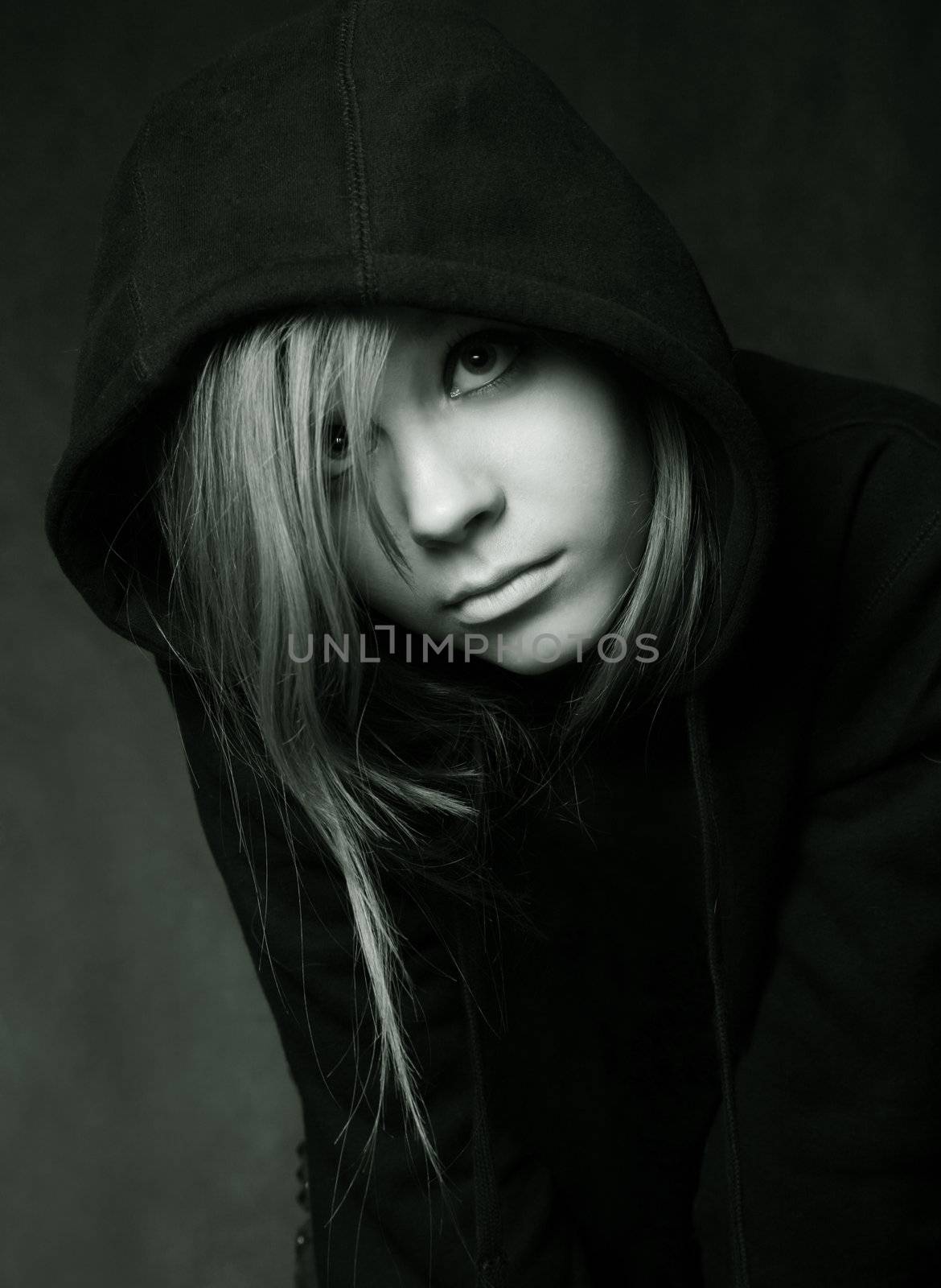 Portrait of the young girl in a black hood