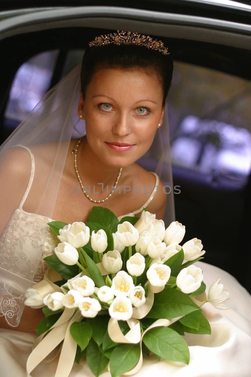 Beautiful the bride in car