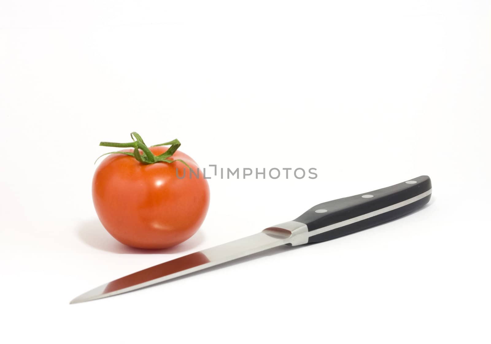 Knife and tomato by ursolv