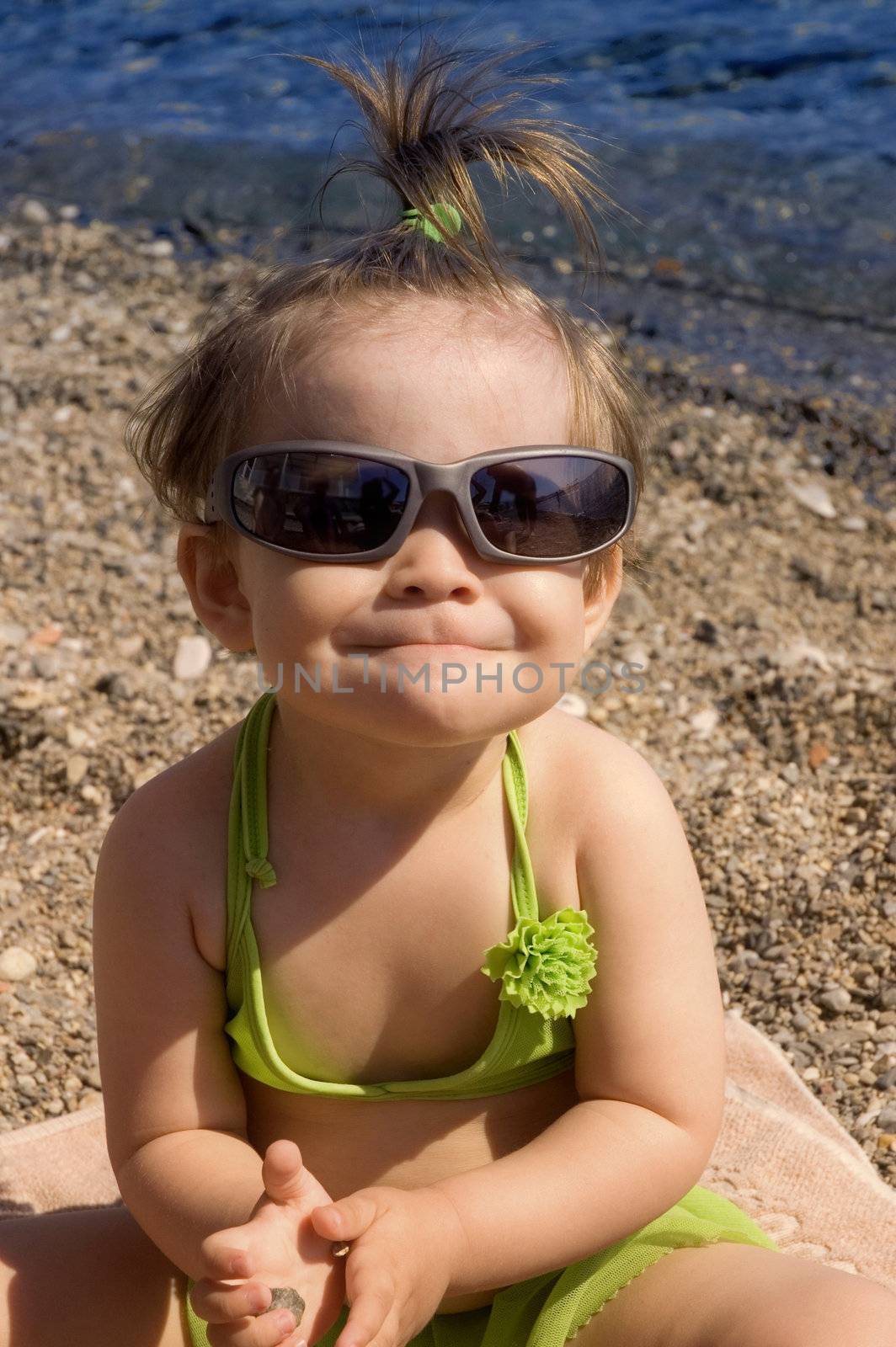 Cute little toddler enjoying the beach