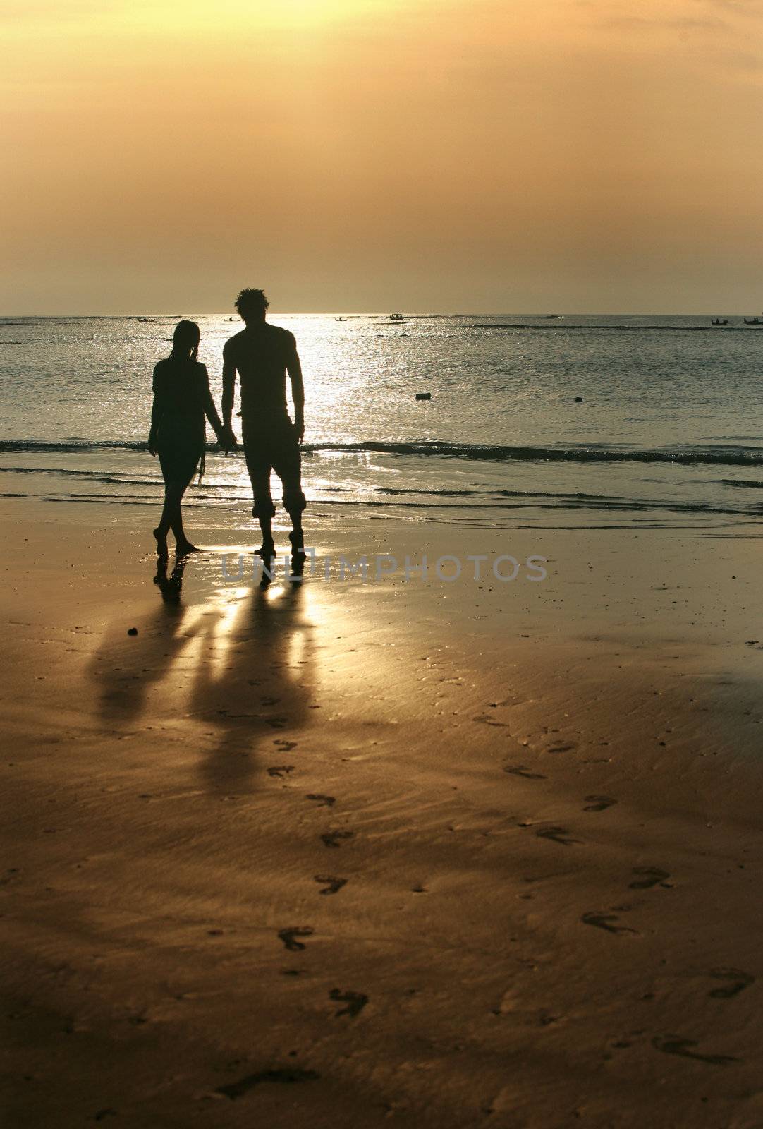 Couple on sunset. Coast of the Indian ocean