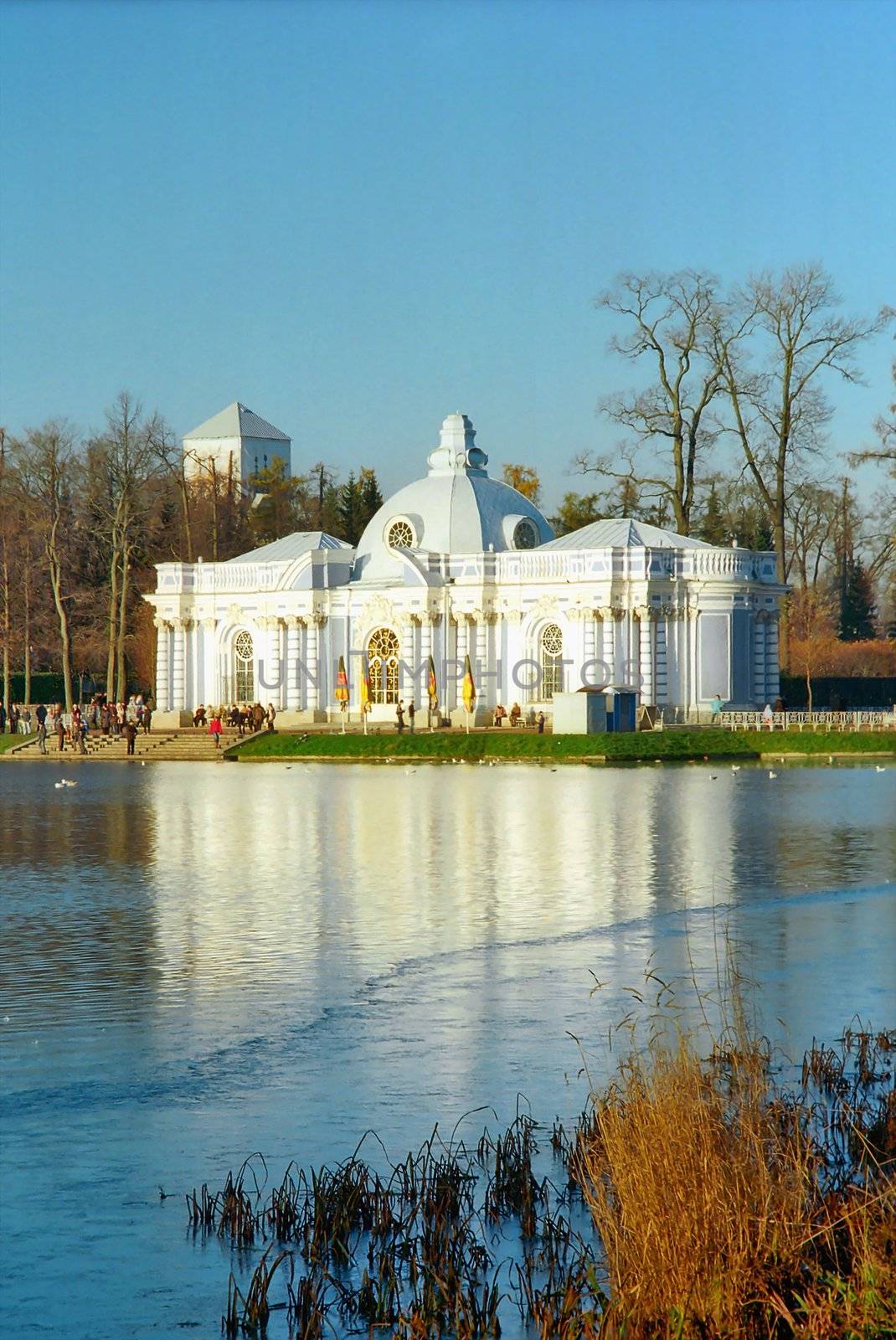 Classical building near the iced lake in winter day