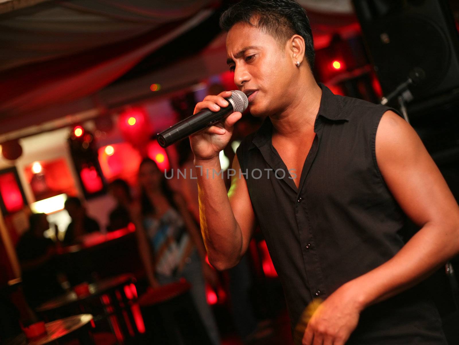 Singer at an alive concert in a night club "La vida loka". Bali. Indonesia