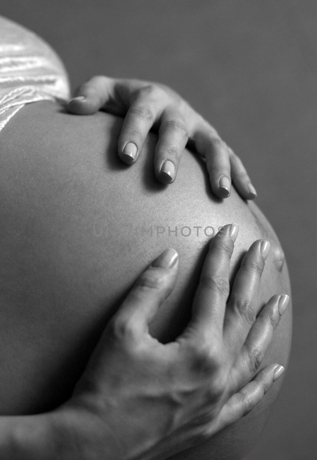 The pregnant woman on the ninth month. The child will be born one of these days