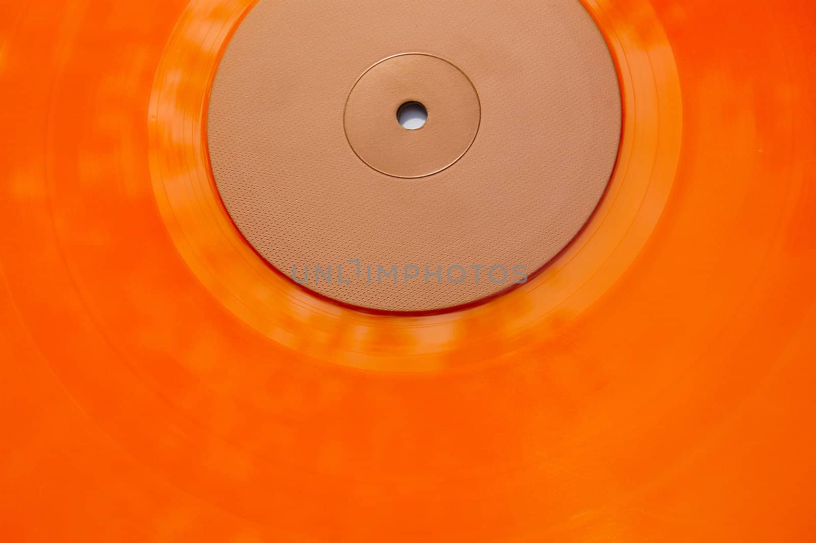 Colored orange vinyl record texture. Abstract background.