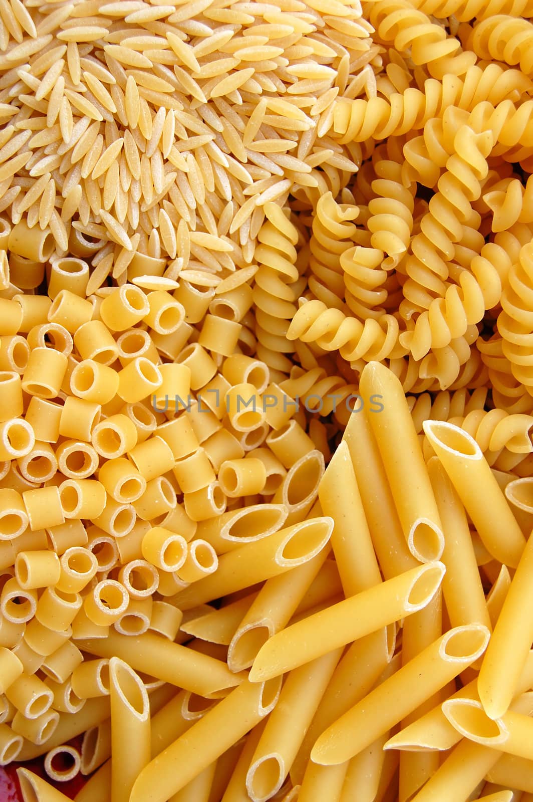 Four different kinds of italian pasta. Food background.