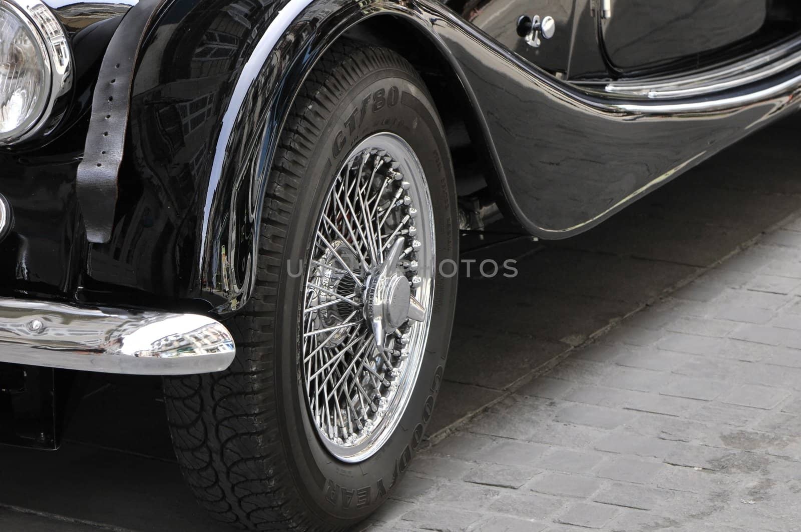 Old chromed head wheel of a Morgan car by shkyo30